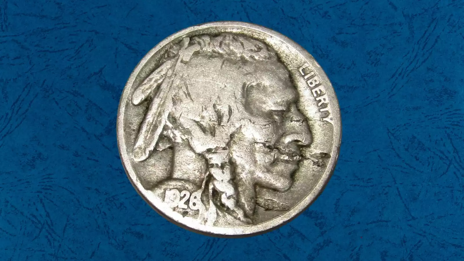 1926 Buffalo nickel lamination error showing planchet metal flaking away from the coin's surface